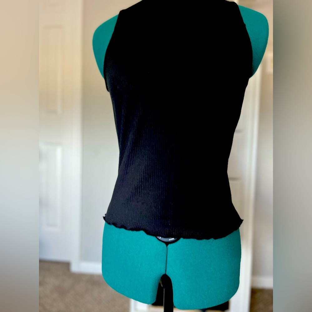 Black sleeveless turtleneck
